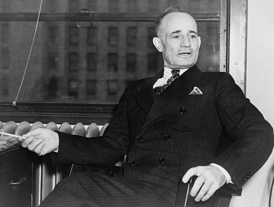Napoleon Hill seated in chair